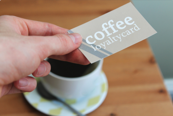 Person using a coffee stamp card